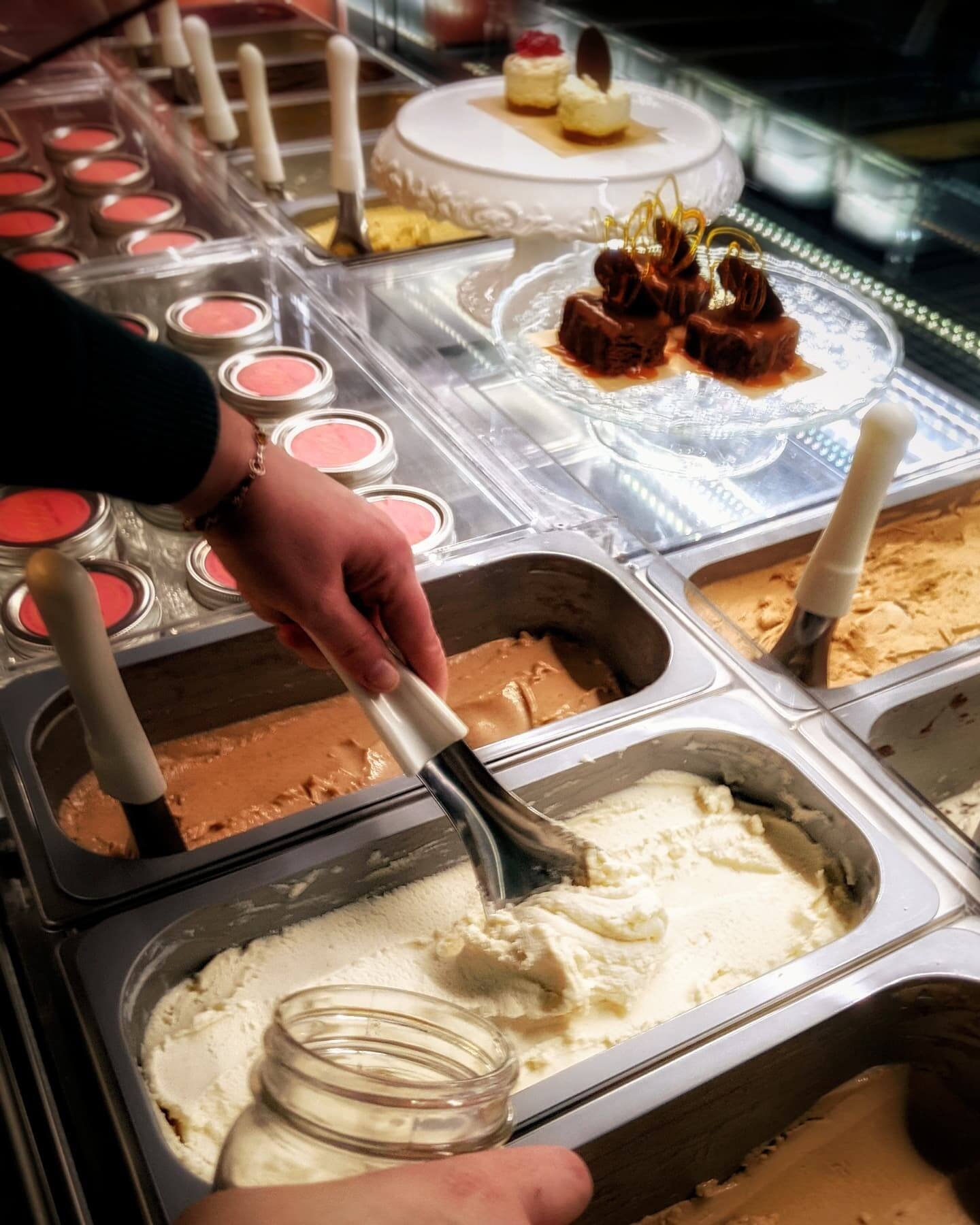 Traditional, authentic, handmade gelato with natural ingredients shown in a case with other desserts at Gina's Gelato in Nelson, BC